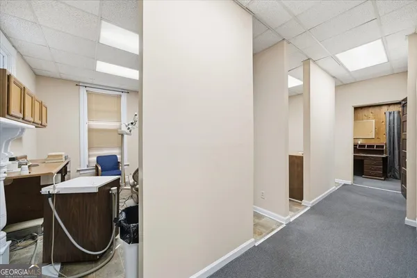 a view of a workspace with furniture