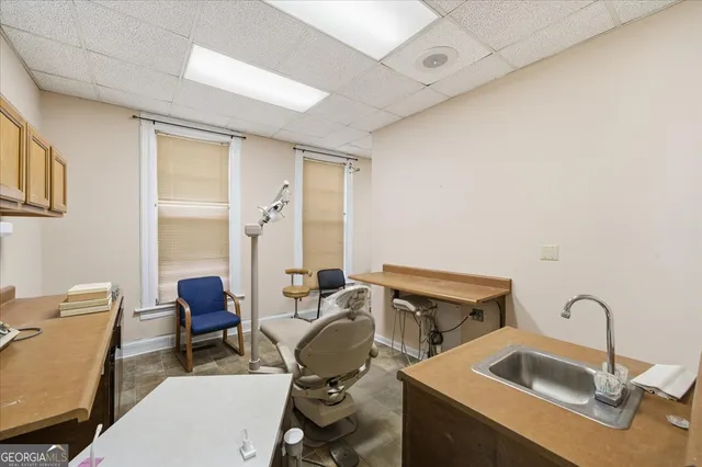 a workspace with furniture and window