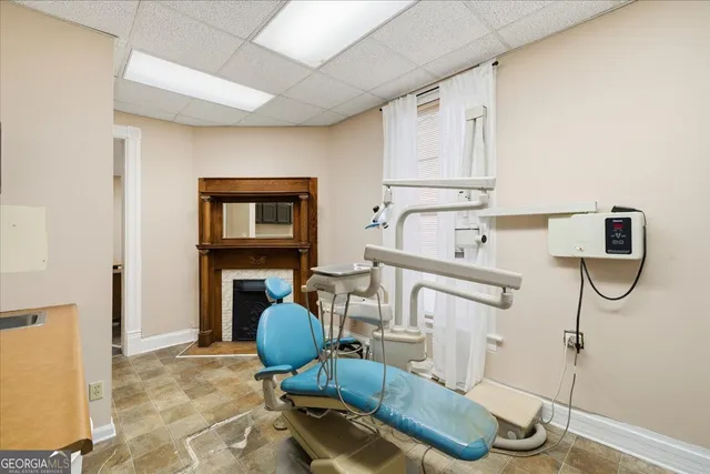 a living room with stainless steel appliances kitchen island granite countertop furniture and a view of living room