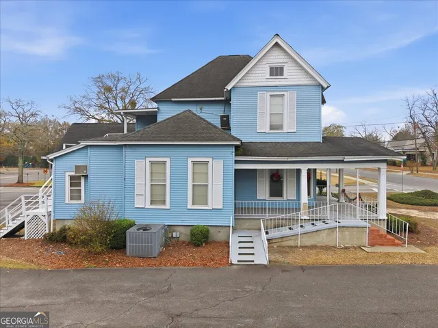 an aerial view of residential houses with outdoor space