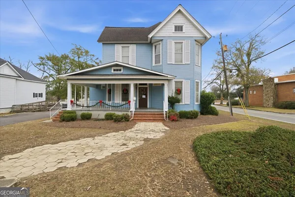 a front view of a house with a yard