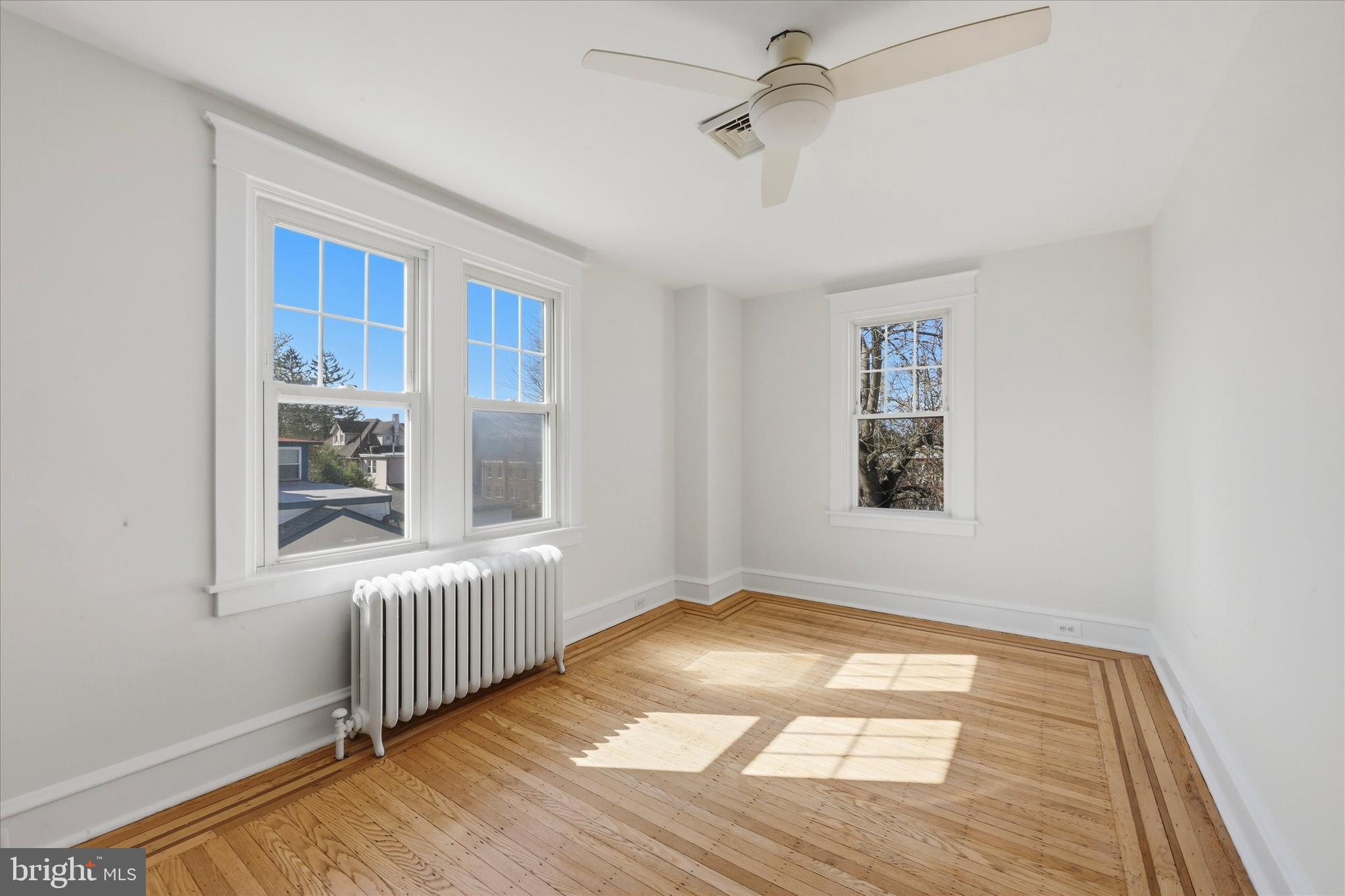 7864 Beverly Boulevard Upper Darby, PA 19082 - Photo 16 of 27 a view of an empty room with a window and wooden floor