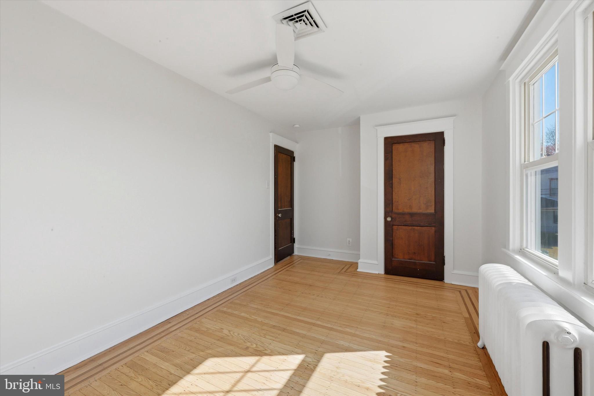 7864 Beverly Boulevard Upper Darby, PA 19082 - Photo 18 of 27 a view of a livingroom with wooden floor and a window