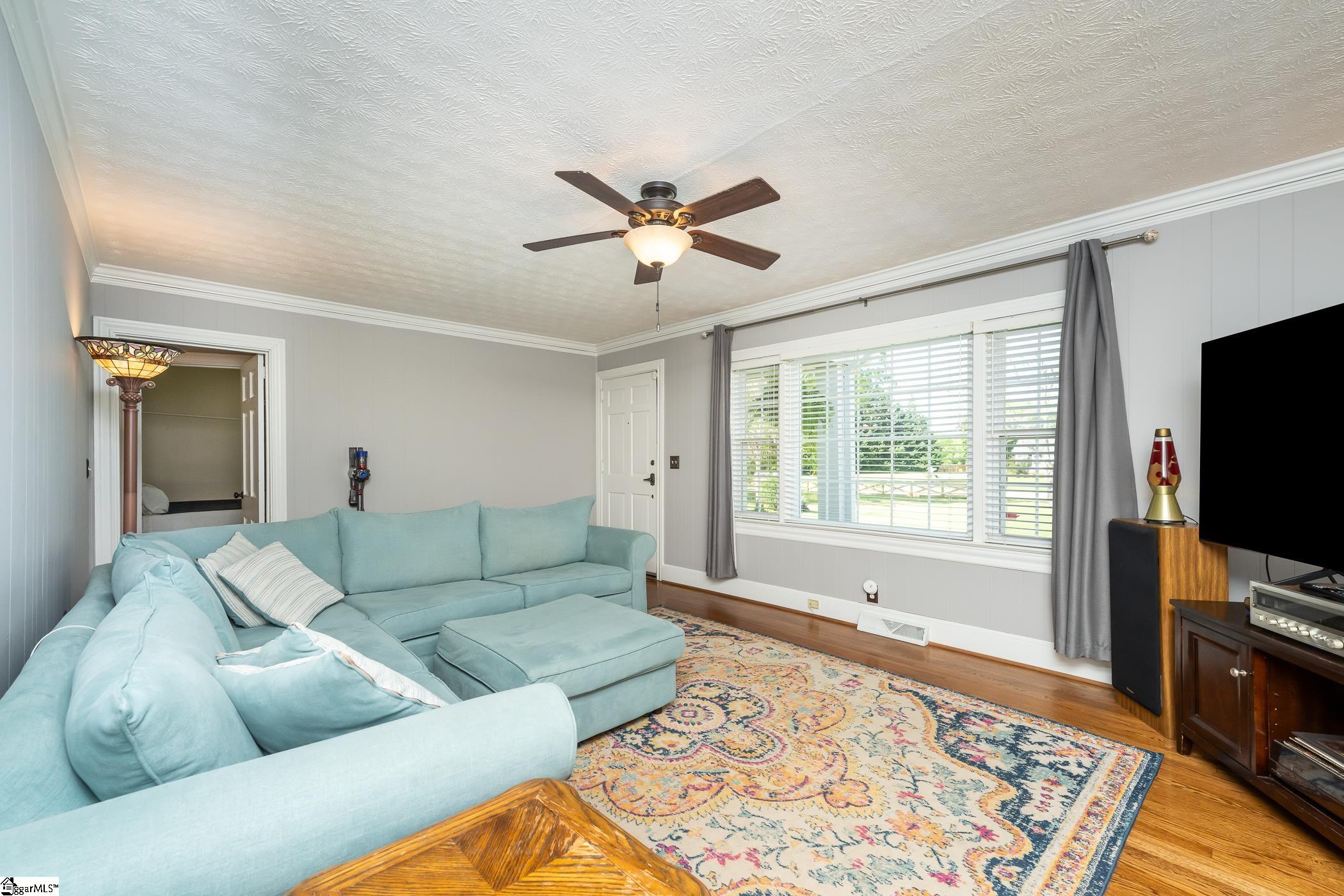 1138 Miller Road Greenville, SC 29607 - Photo 3 of 32 Wall of windows and hardwood floors.