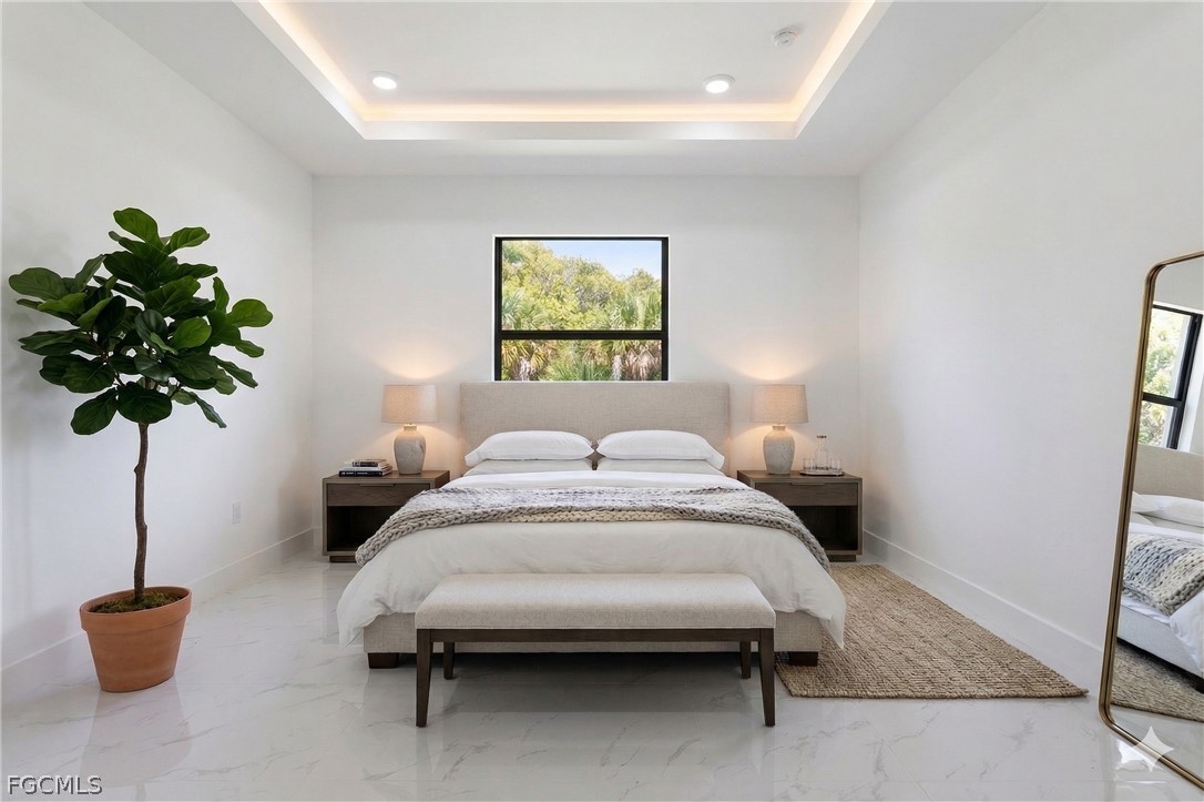 1253 Argosy Road LaBelle, FL 33935 - Photo 11 of 35 a bedroom with bed and a potted plant