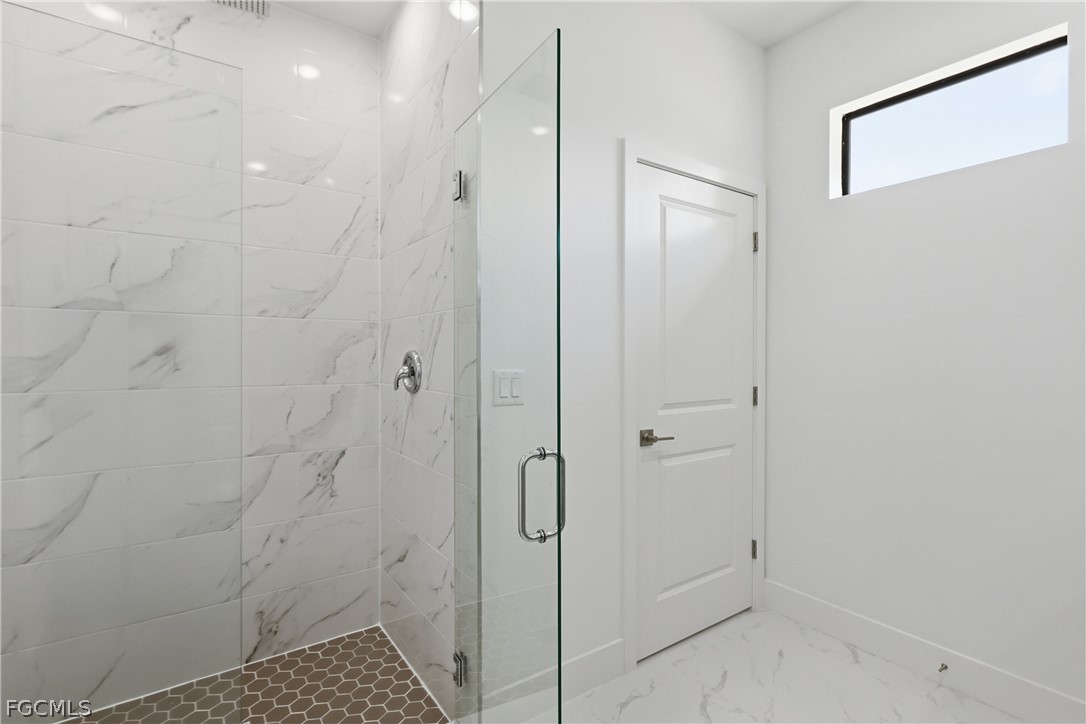 1253 Argosy Road LaBelle, FL 33935 - Photo 16 of 35 a bathroom with a shower