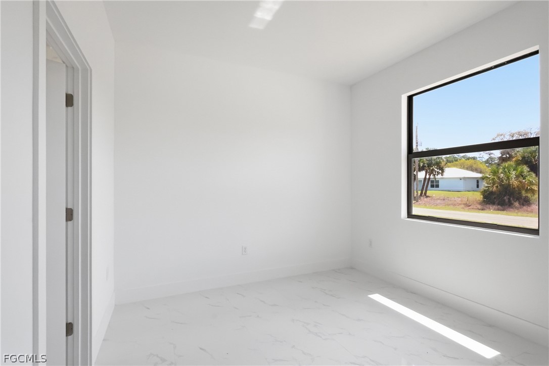 1253 Argosy Road LaBelle, FL 33935 - Photo 20 of 35 a view of an empty room with a window