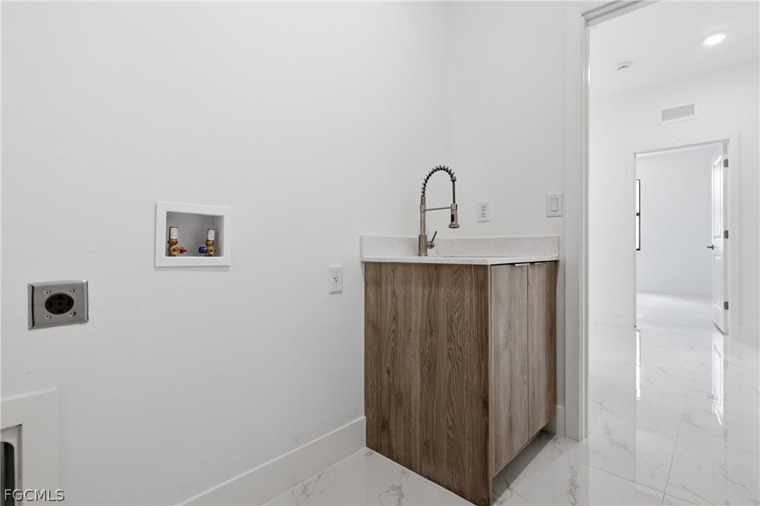 1253 Argosy Road LaBelle, FL 33935 - Photo 28 of 35 a view of a bathroom with a sink