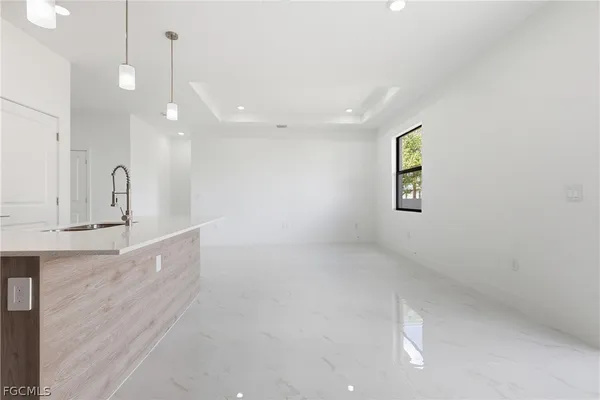 a kitchen with stainless steel appliances granite countertop a stove and a microwave