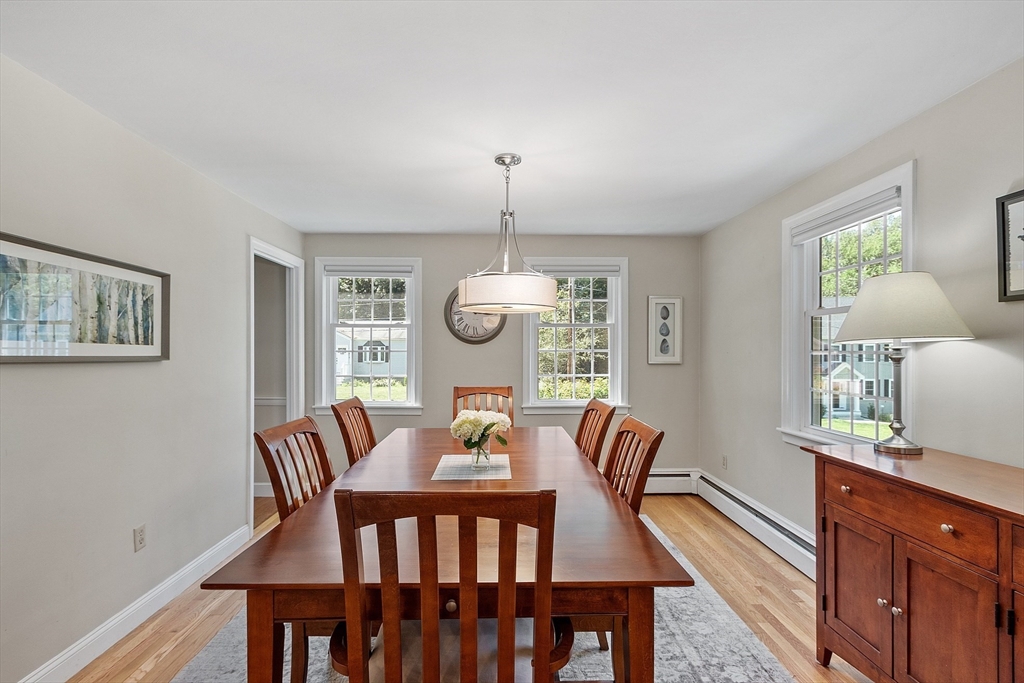 27 Mill Lane Littleton, MA 01460 - Photo 11 of 38 a view of a dining room with furniture window and wooden floor