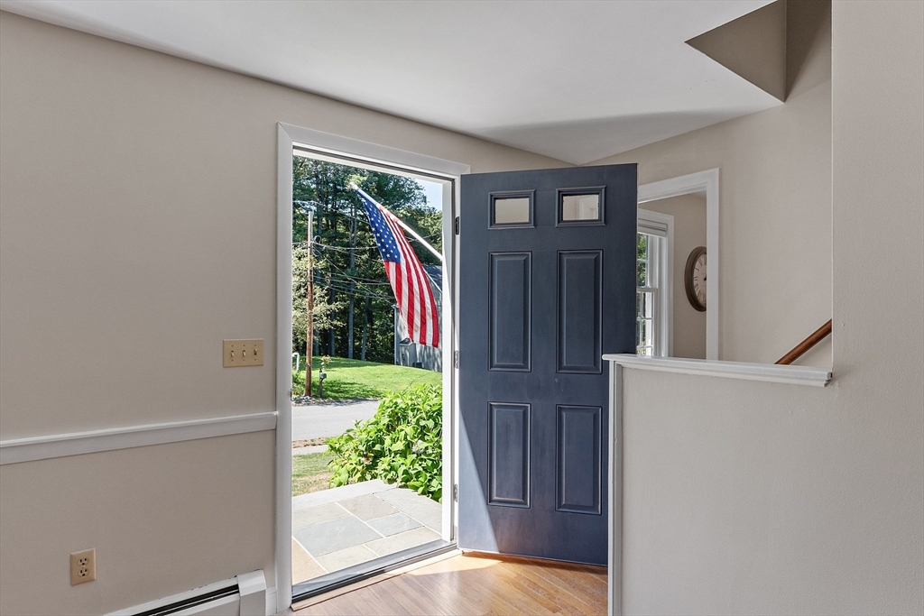27 Mill Lane Littleton, MA 01460 - Photo 12 of 38 a view of a front door and wooden floor