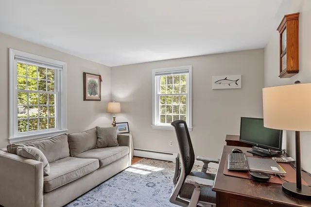 a workspace with furniture and a window