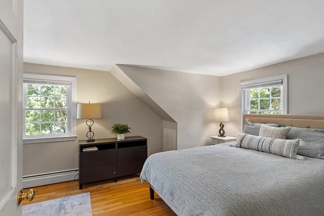 a bedroom with a bed and window