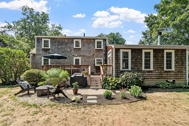 a house view with a sitting space and garden space