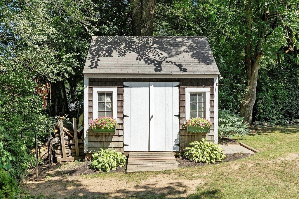 27 Mill Lane Littleton, MA 01460 - Photo 30 of 38 front view of a house with potted plants