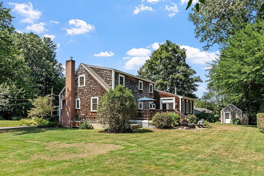 27 Mill Lane Littleton, MA 01460 - Photo 32 of 38 a front view of house with yard and trees