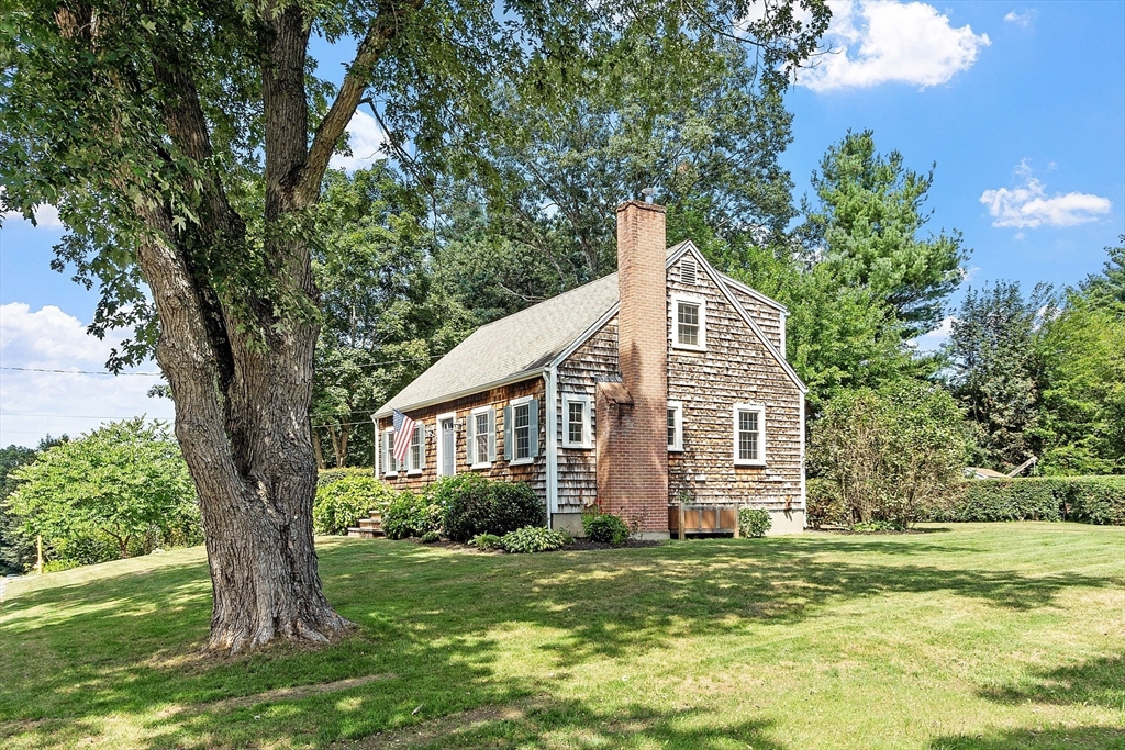 27 Mill Lane Littleton, MA 01460 - Photo 34 of 38 a view of a house with a yard