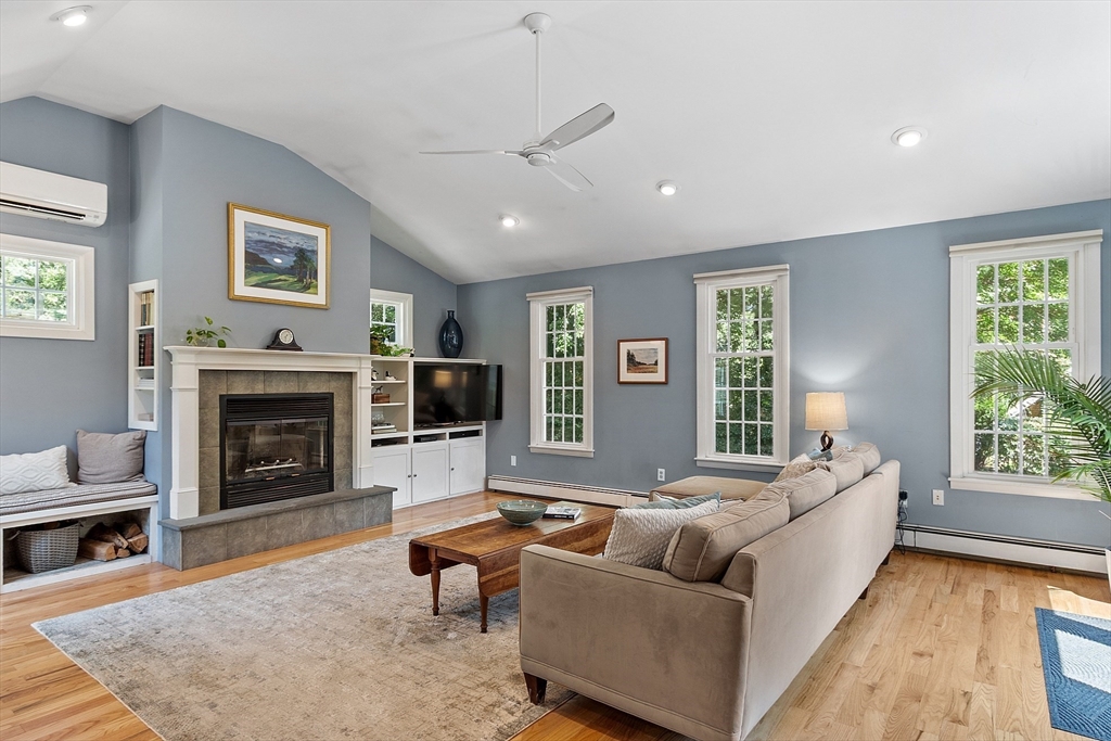 27 Mill Lane Littleton, MA 01460 - Photo 5 of 38 a living room with furniture and a fireplace