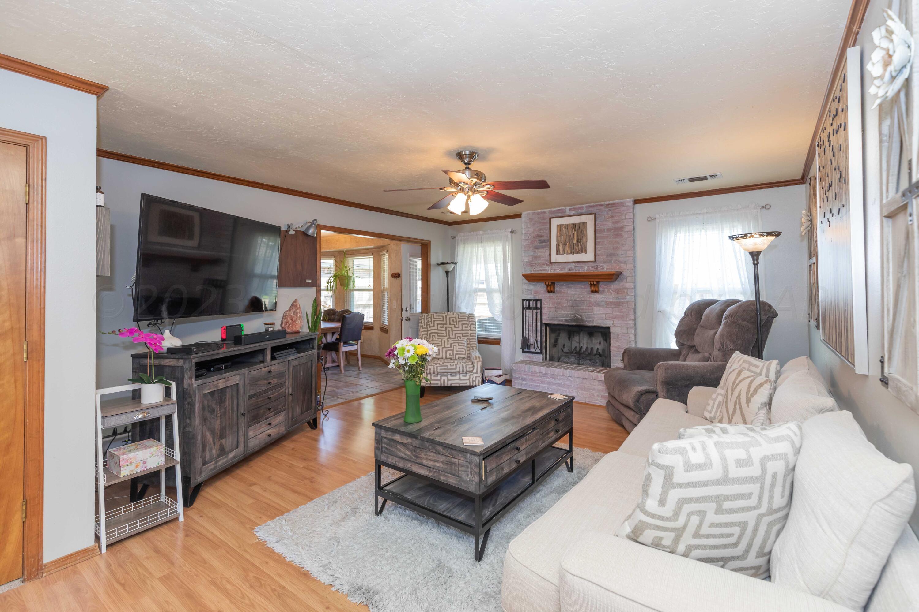 4205 Jamie Trail Amarillo, TX 79110 - Photo 7 of 36 a living room with furniture and a flat screen tv