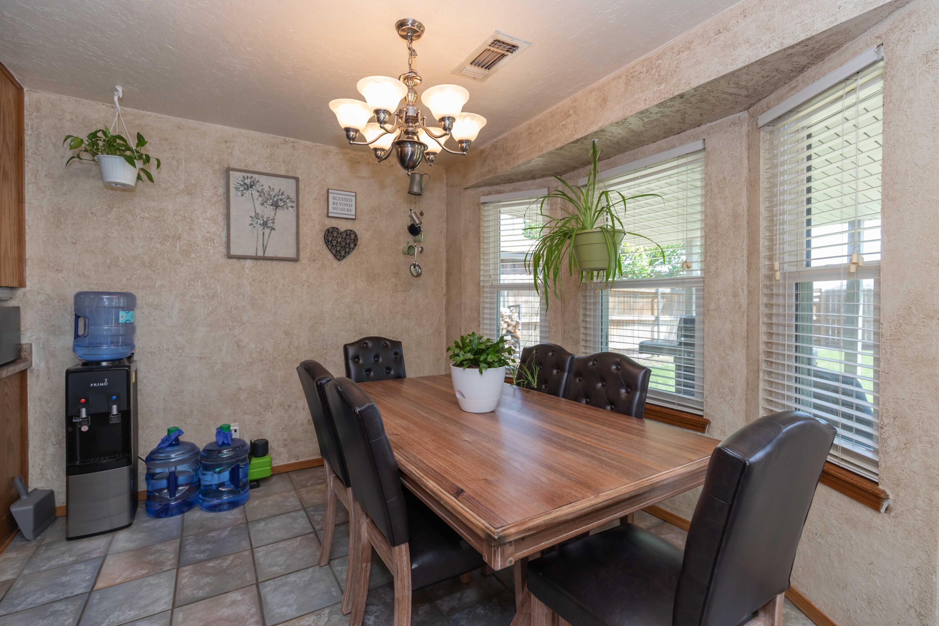 4205 Jamie Trail Amarillo, TX 79110 - Photo 9 of 36 a view of a dining room with furniture window and outside view