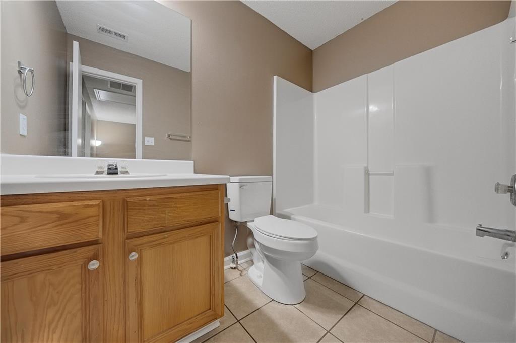 4203 Legacy Square Atlanta, GA 30349 - Photo 35 of 35 a bathroom with a sink toilet and shower