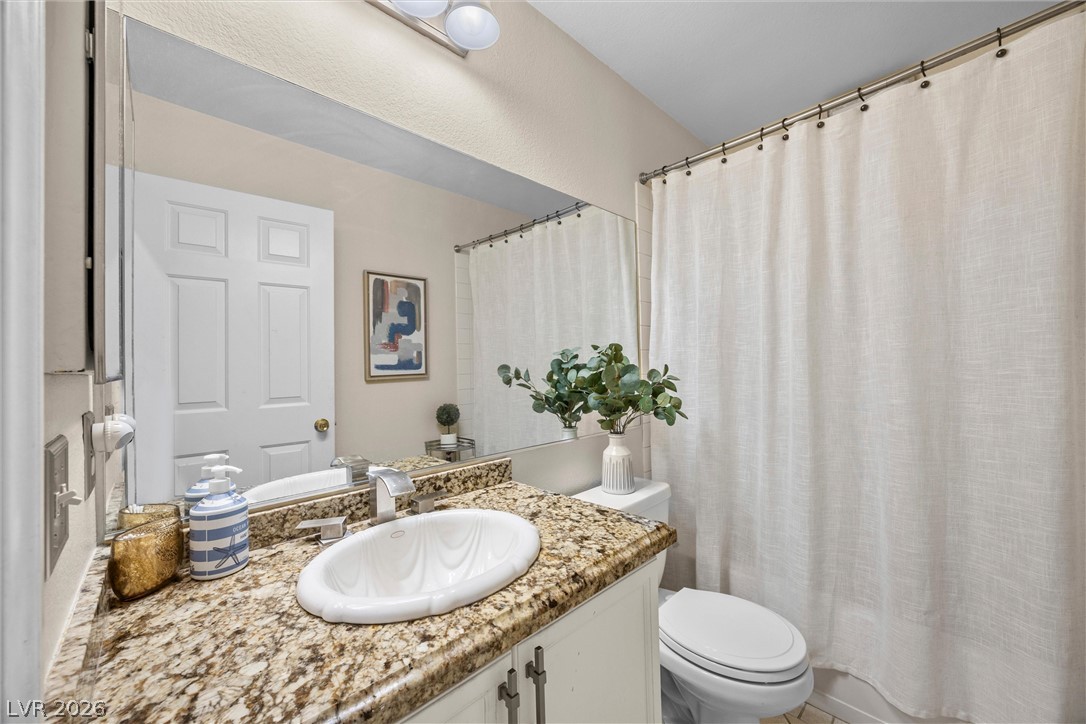 814 Manor Shores Road Henderson, NV 89002 - Photo 24 of 40 Polished granite countertops complement the clean design of this functional bathroom space.