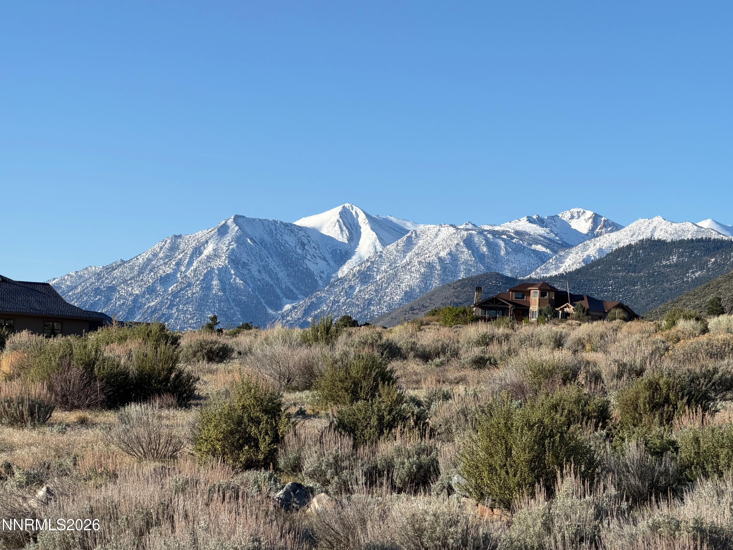 2953 Jacks Court, Unit 71 Genoa, NV 89411 - Photo 1 of 13 a view of a house with a mountain and a forest