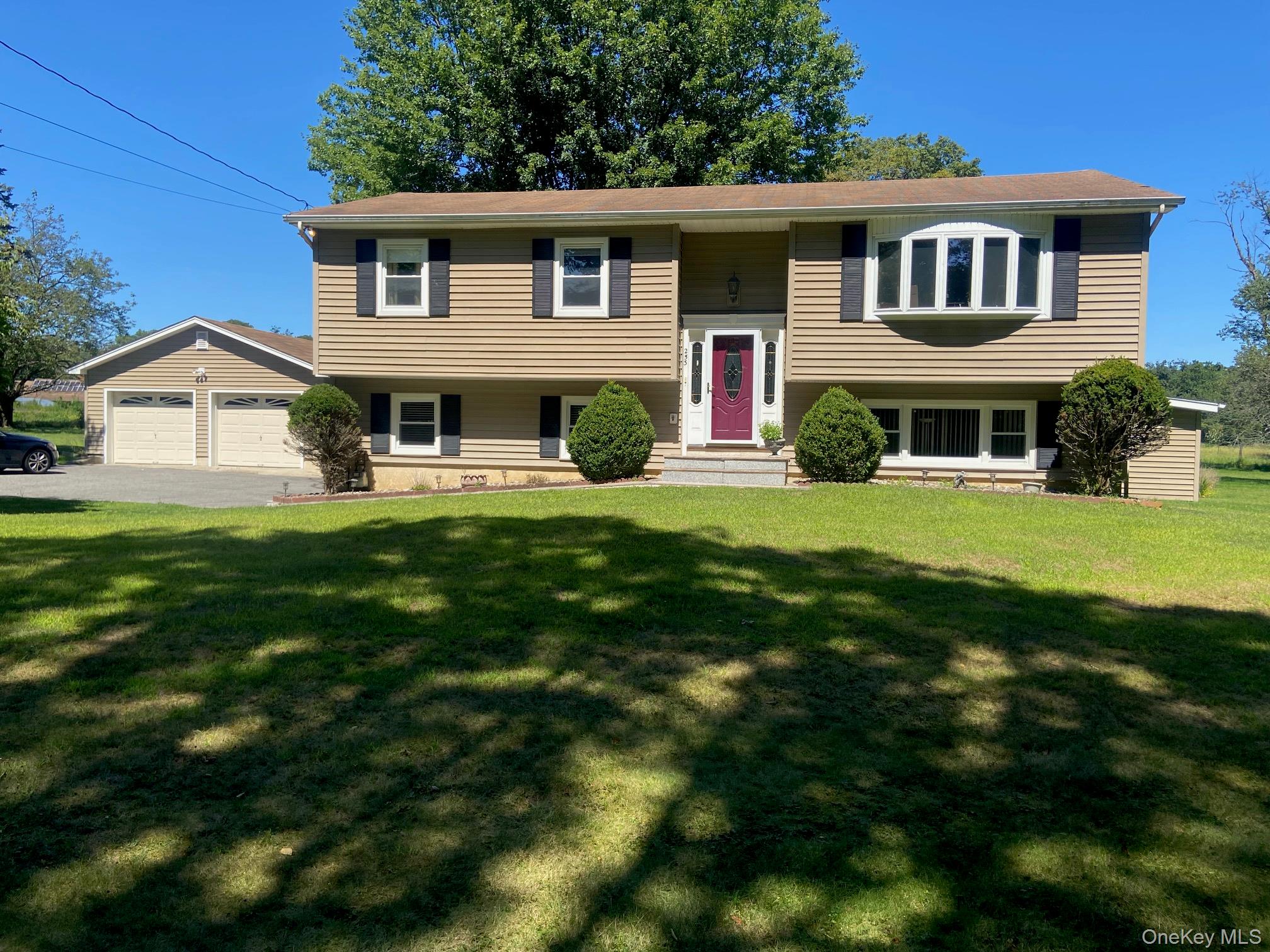 253 Ackertown Road Monsey, NY 10952 - Photo 1 of 38 Raised ranch featuring a front lawn and an attached garage