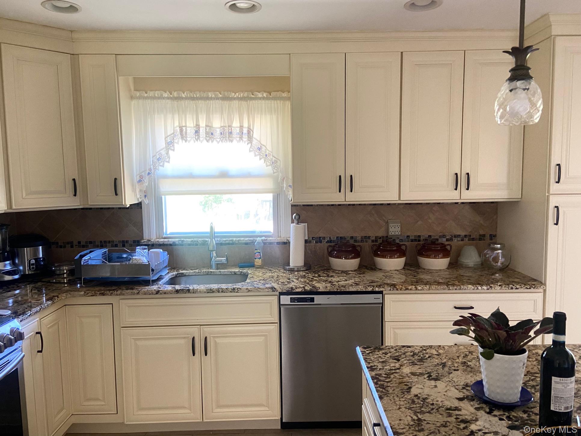 253 Ackertown Road Monsey, NY 10952 - Photo 15 of 38 Kitchen featuring appliances with stainless steel finishes, dark stone countertops, tasteful backsplash, decorative light fixtures, and recessed lighting