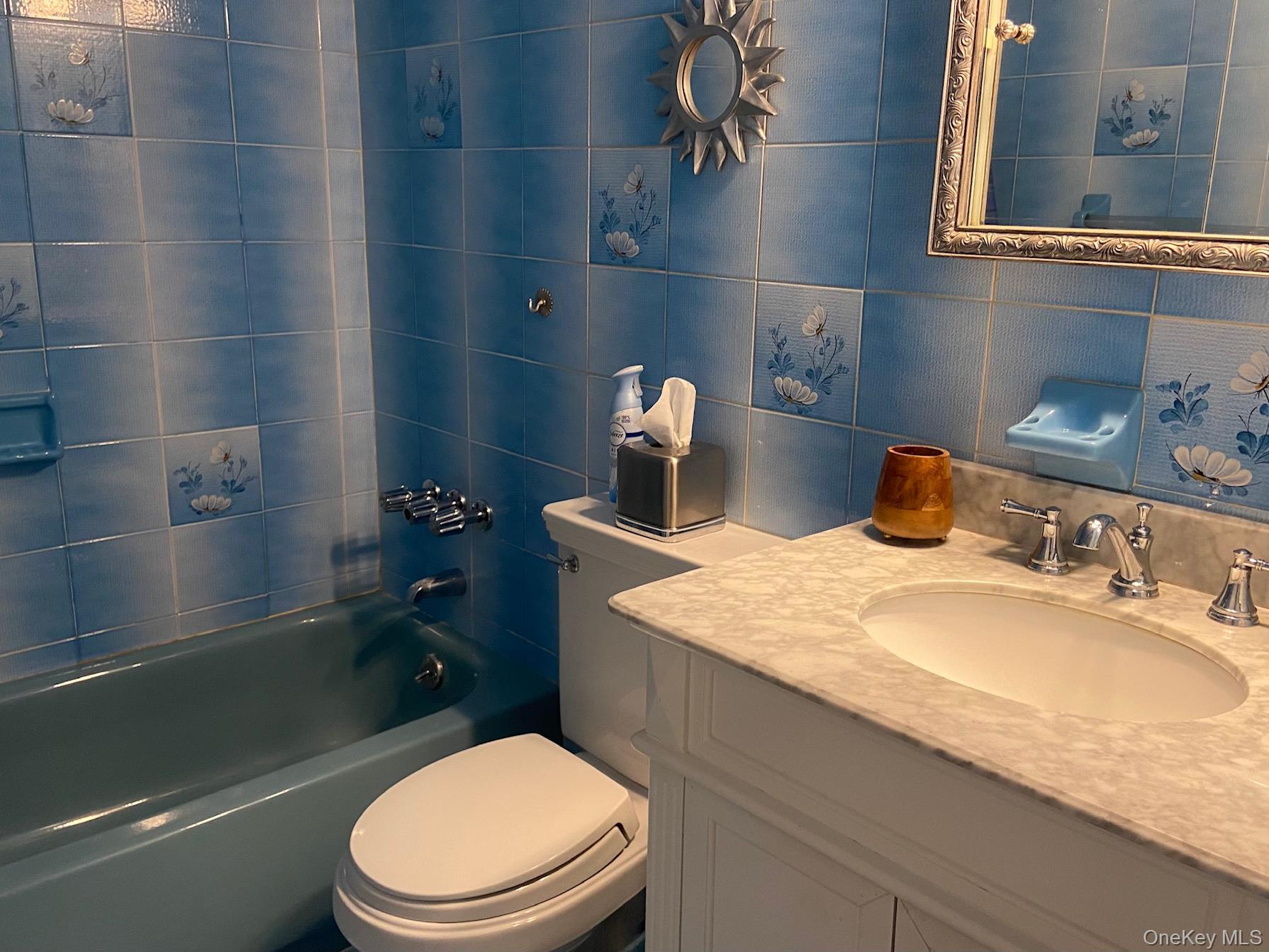 253 Ackertown Road Monsey, NY 10952 - Photo 17 of 38 Full bath with tile walls, tub / shower combination, vanity, and tasteful backsplash