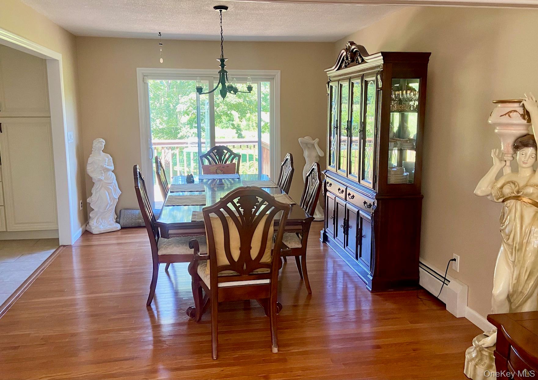 253 Ackertown Road Monsey, NY 10952 - Photo 7 of 38 Dining room featuring light wood finished floors, and sliders to deck