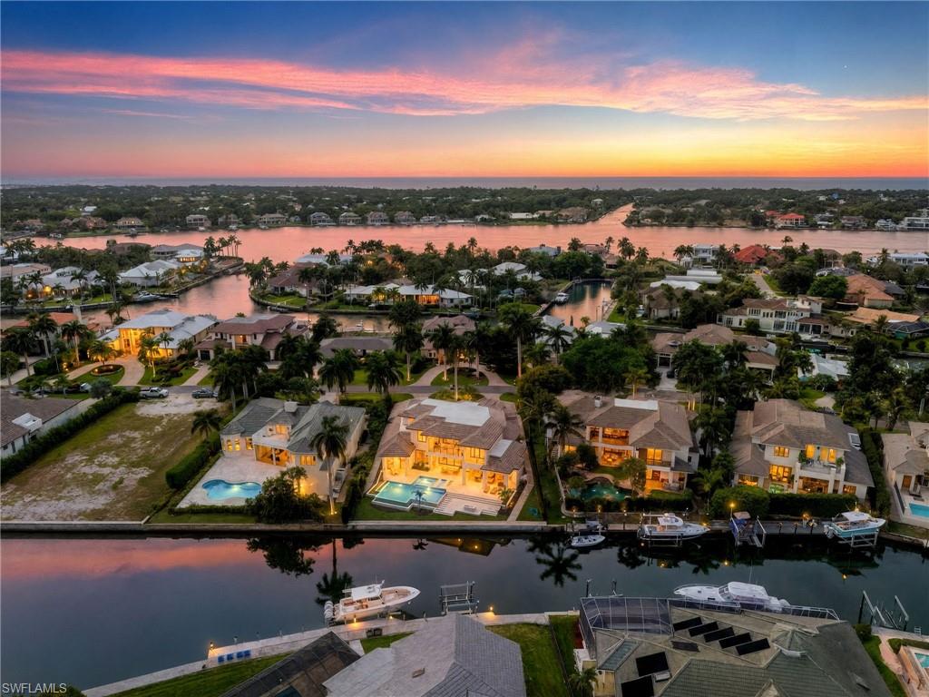 2345 Tarpon Road Naples, FL 34102 - Photo 42 of 43 Aerial view at dusk of a water view and a residential view