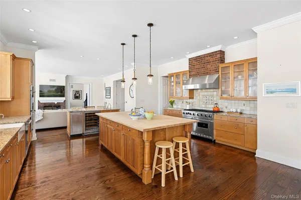 a large kitchen with a table and chairs