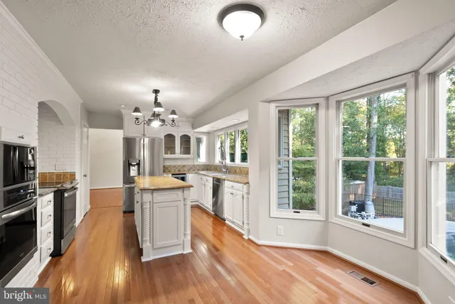 a view of a hallway with windows