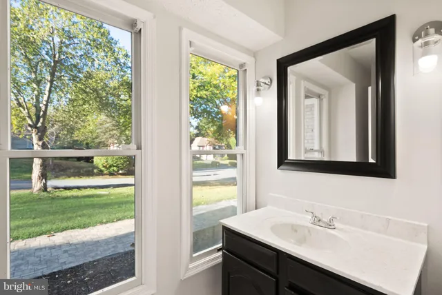 a view of a room with wooden floor and window