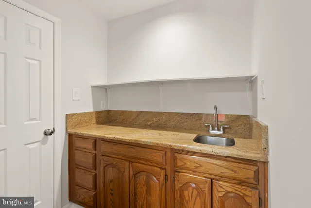 a spacious bathroom with a shower and a sink