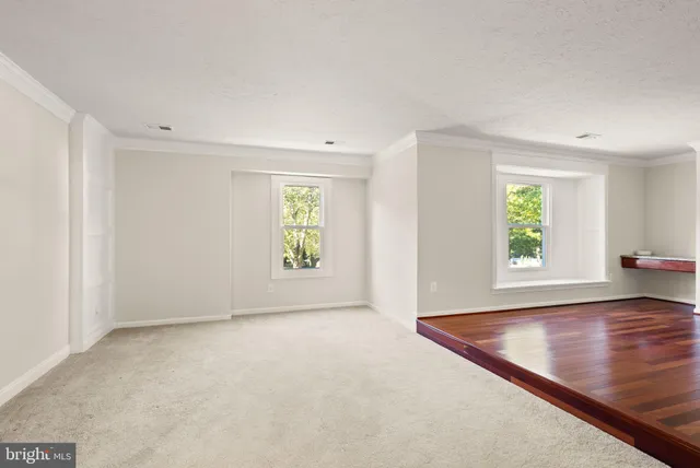 a view of a balcony with wooden floor