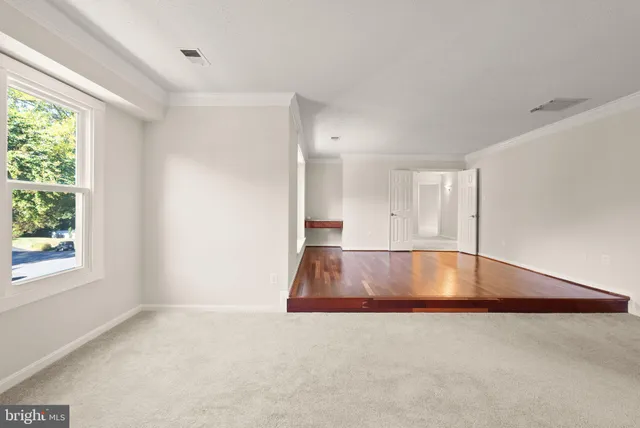 a view of a backyard with swimming pool