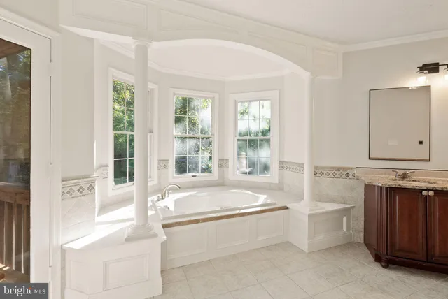 an aerial view of a house with garden space and street view