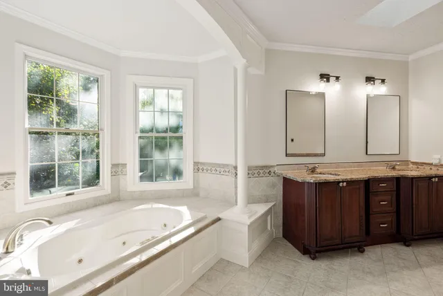 an aerial view of a house with garden space and street view