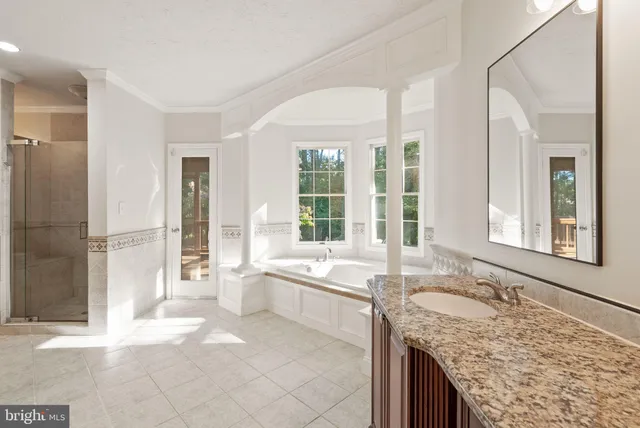 an aerial view of a house with a swimming pool