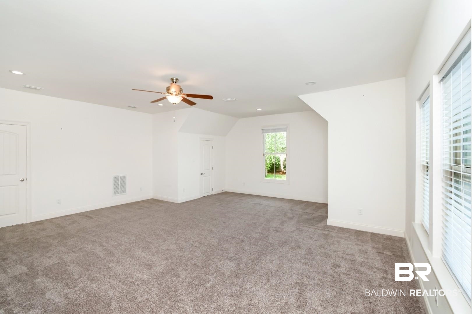 3528 Rue Royal Mobile, AL 36693 - Photo 41 of 53 Spacious room featuring neutral carpet flooring, recessed lighting, and a ceiling fan with light fixture