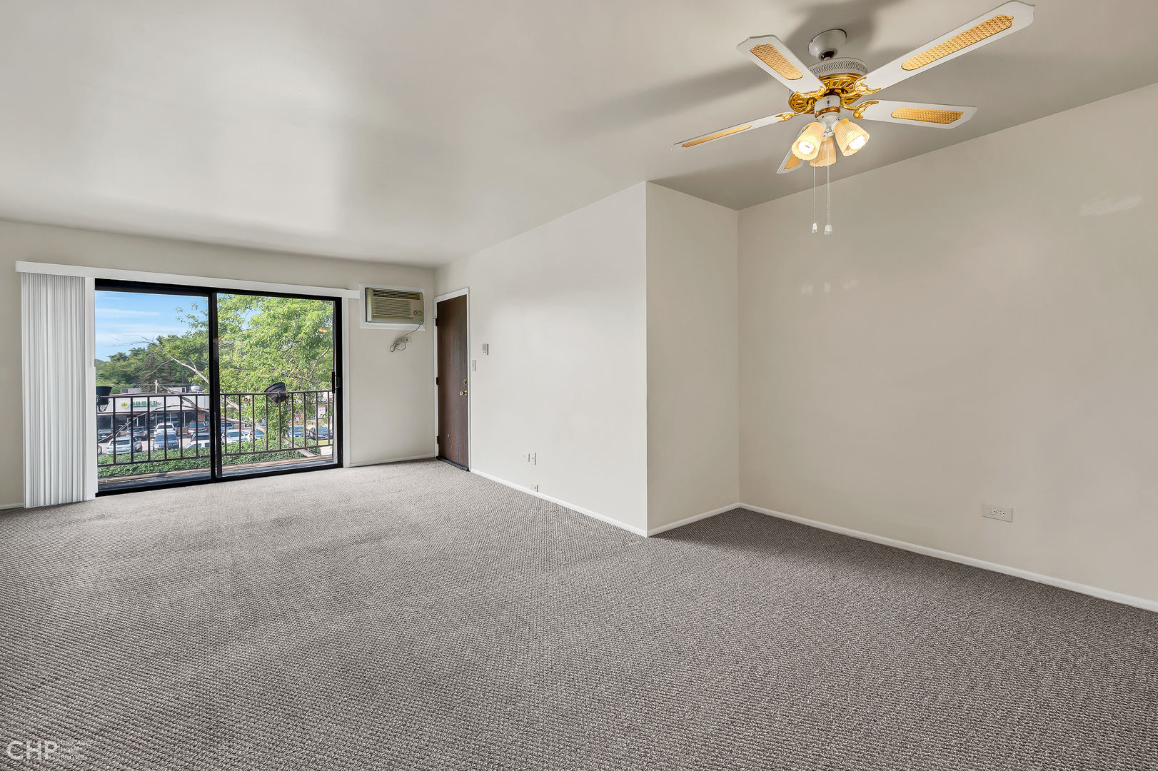 3750 Salem Walk, Unit B2 Northbrook, IL 60062 - Photo 2 of 15 a view of a big room with windows and chandelier fan