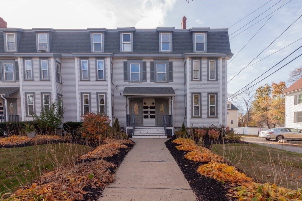 10 Maple Avenue, Unit 3 Andover, MA 01810 - Photo 2 of 11 a view of a building with many windows next to a yard