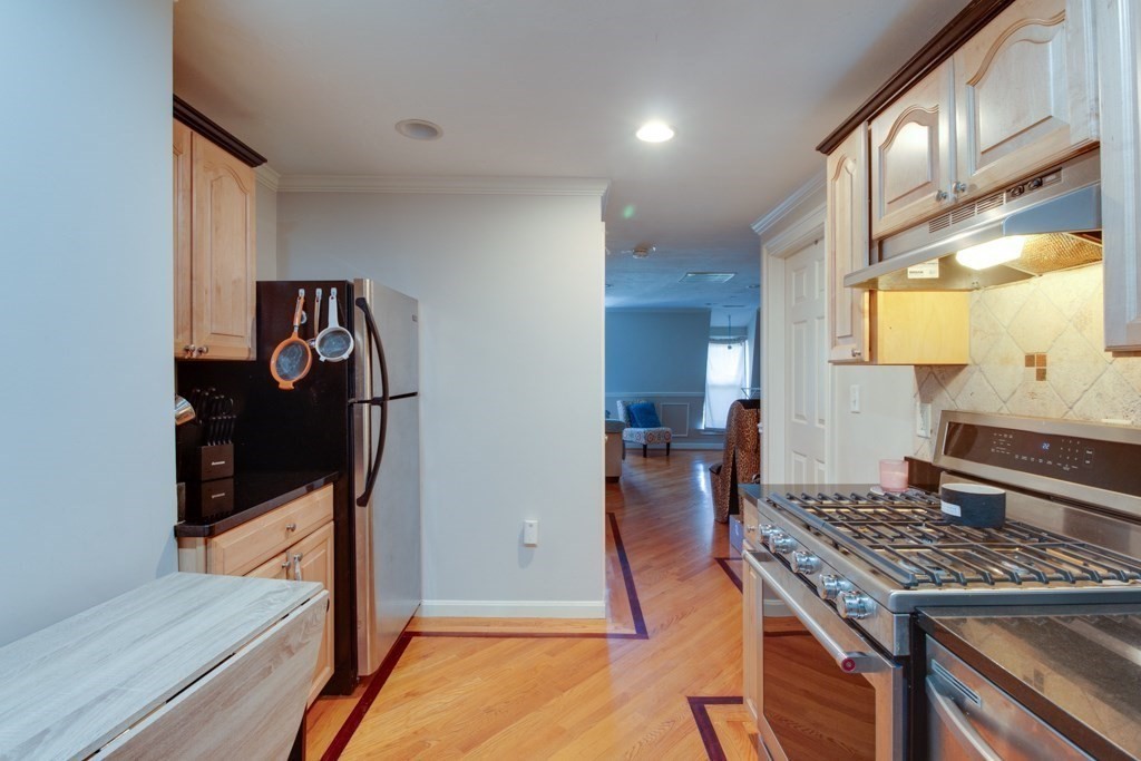 10 Maple Avenue, Unit 3 Andover, MA 01810 - Photo 8 of 11 a kitchen view of a stove and a refrigerator