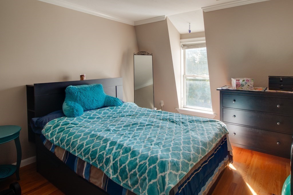 10 Maple Avenue, Unit 3 Andover, MA 01810 - Photo 9 of 11 a bedroom with a bed and window