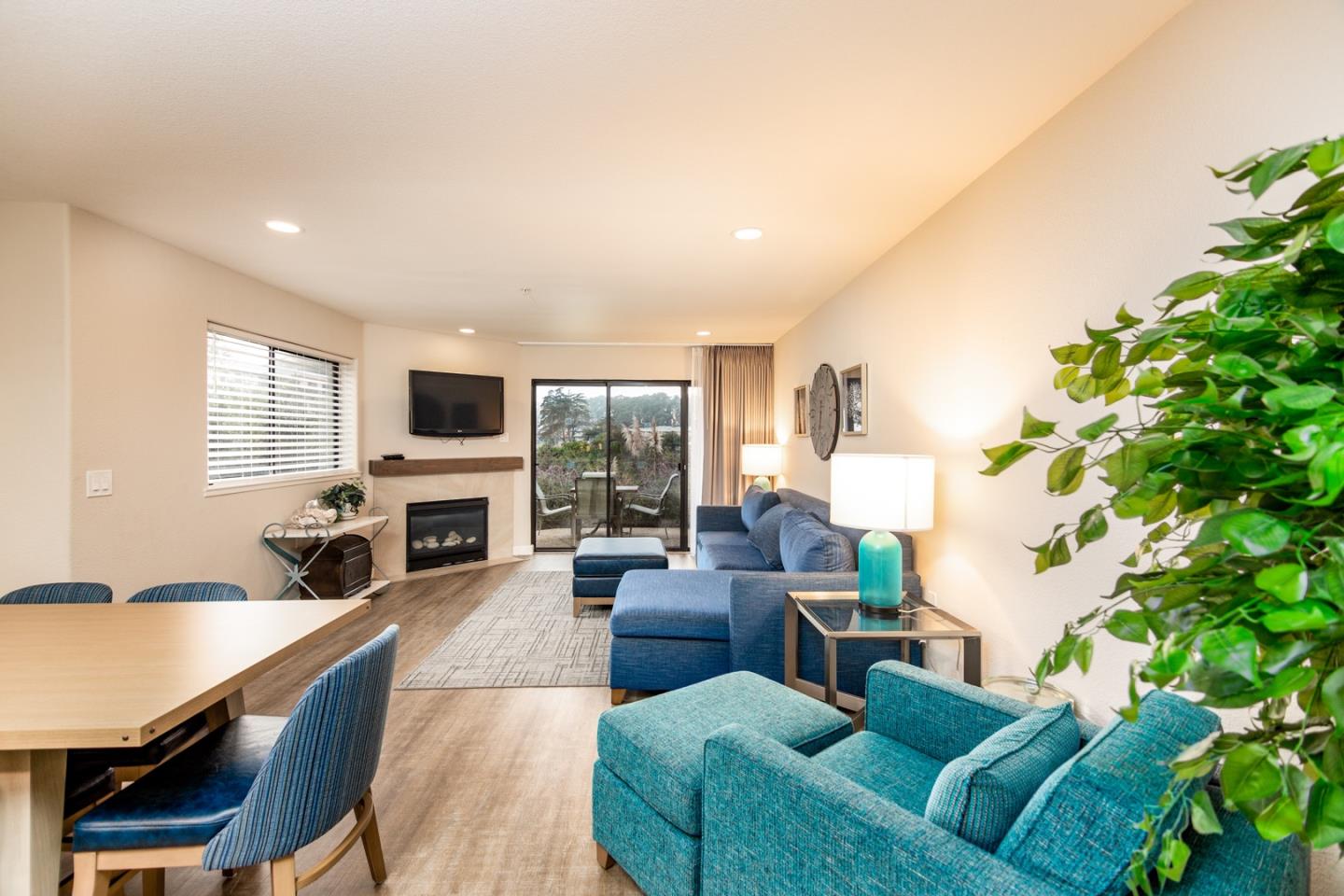 449 Seascape Resort Drive Aptos, CA 95003 - Photo 3 of 14 a living room with furniture fireplace and flat screen tv