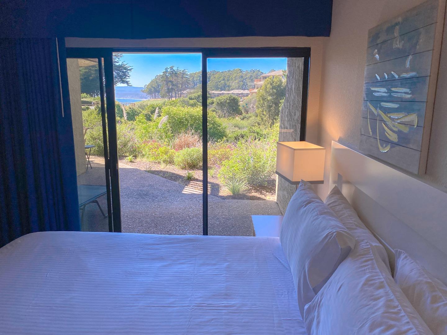 449 Seascape Resort Drive Aptos, CA 95003 - Photo 7 of 14 a bed sitting in a bedroom next to a window