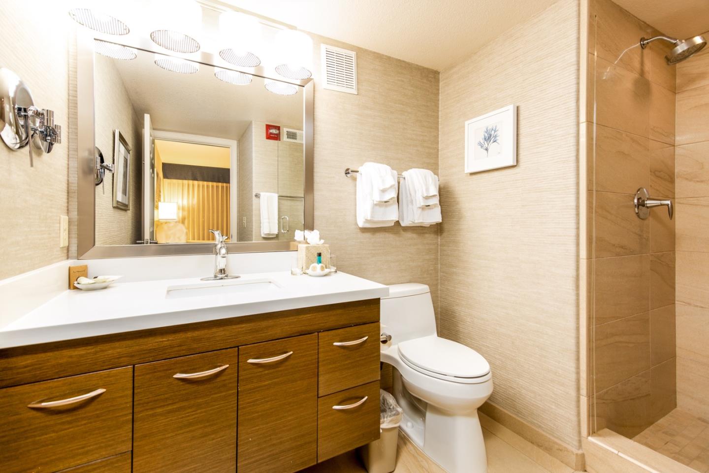 449 Seascape Resort Drive Aptos, CA 95003 - Photo 8 of 14 a bathroom with a toilet sink and mirror