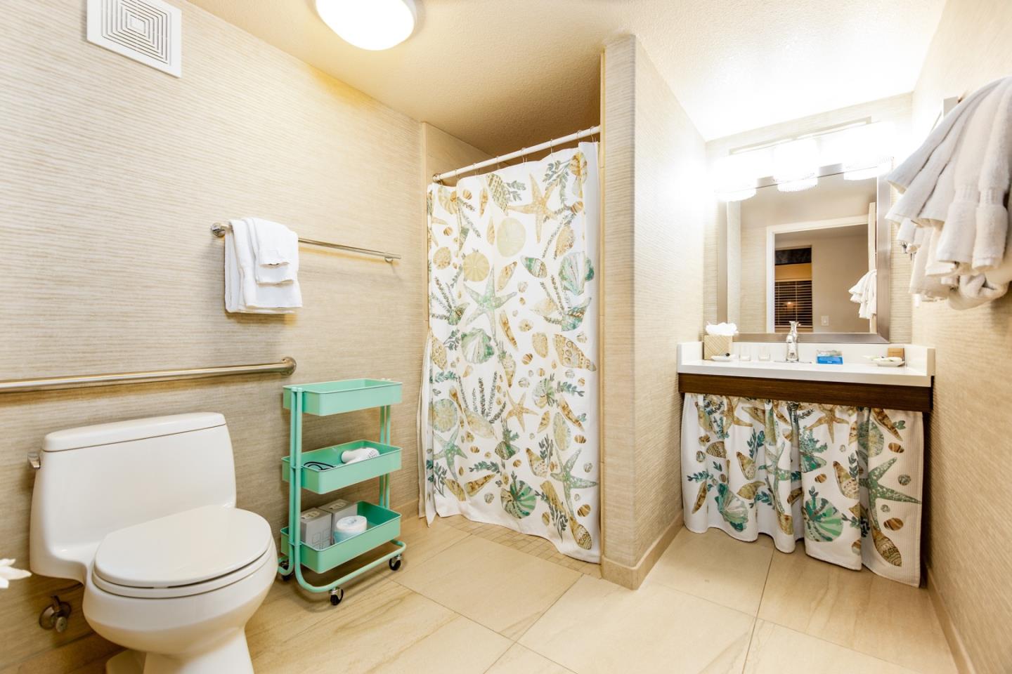 449 Seascape Resort Drive Aptos, CA 95003 - Photo 9 of 14 a bathroom with a toilet sink and mirror